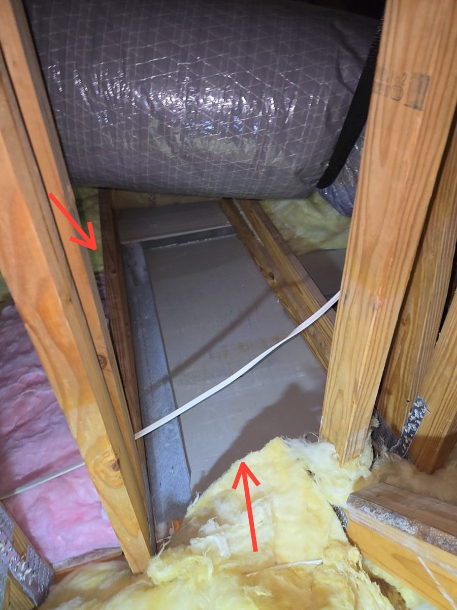 Missing attic insulation exposing ceiling drywall in a 2015 Naples home during a buyer's home inspection