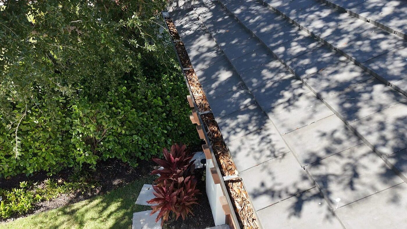 Gutter clogged with leaves on a new-construction home that sat unsold