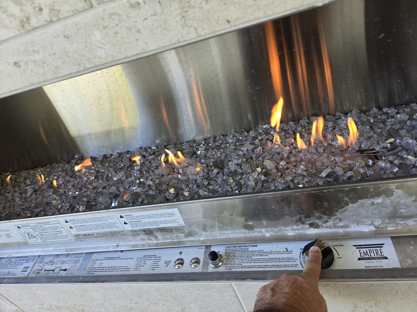 Outdoor gas fireplace that stayed lit only while the ignition button was held