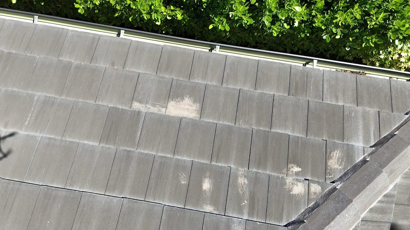 Paint stains on concrete roof tiles left from construction