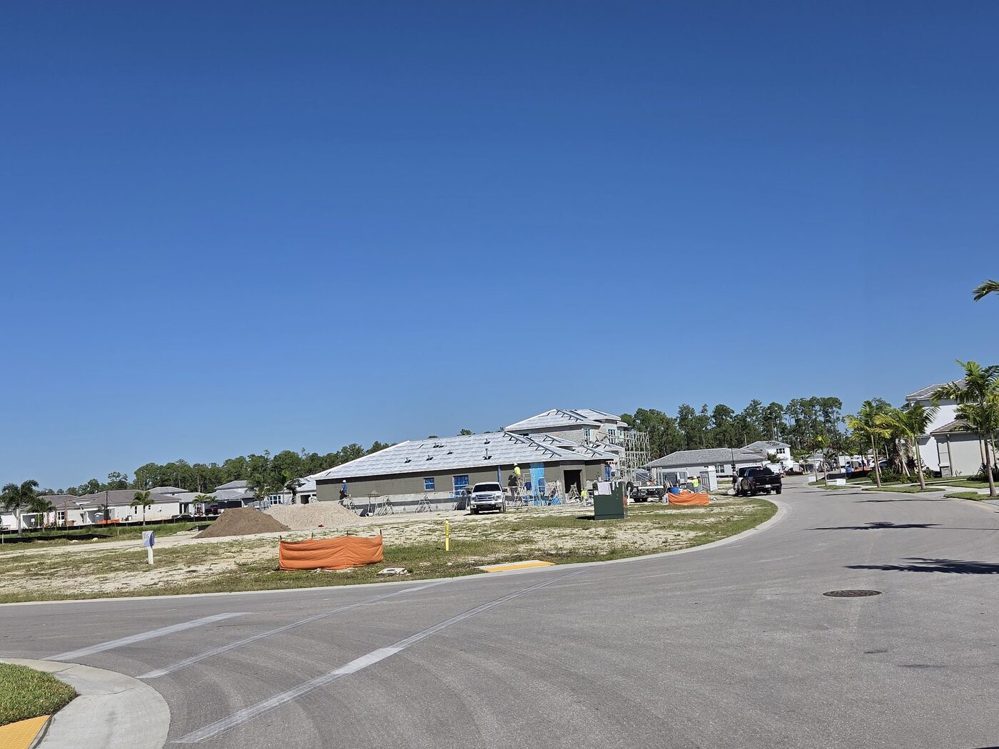 New construction home in Valencia Sky, Naples, FL, with block walls up and roof underlayment on, before tile